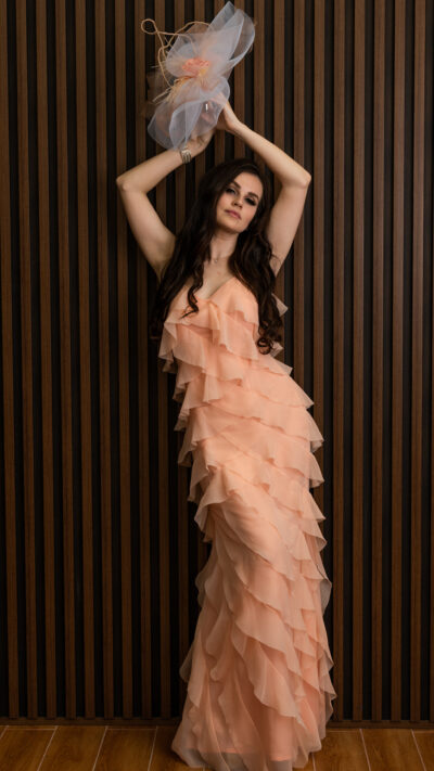 woman wearing chiffon ruffled dress peach colour