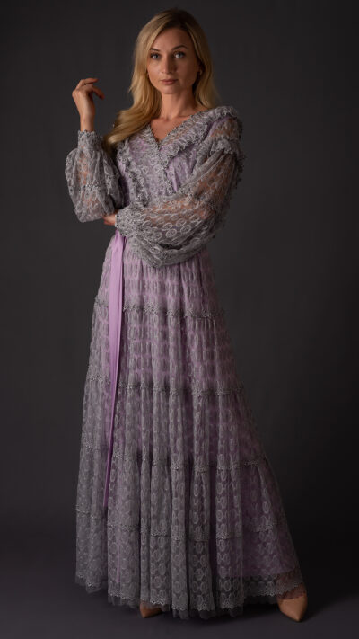 woman wearing long dress grey colour made of lace fabric