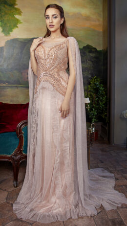 woman wearing long evening gown with beaded top champagne colour