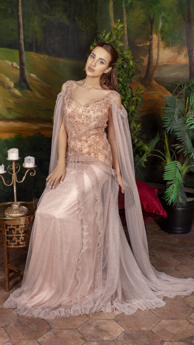 woman wearing long hand beaded evening gown