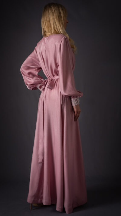 woman wearing long pink kaftan style dress view from the back