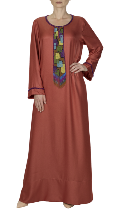 woman wearing orange embroidered jalabiya style dress