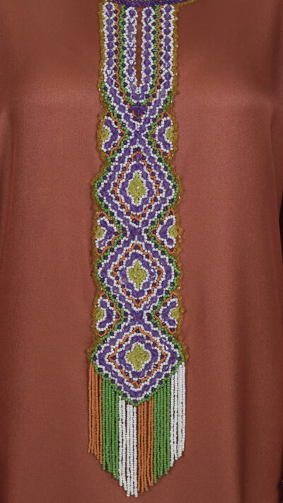 close up details of embroidered dress