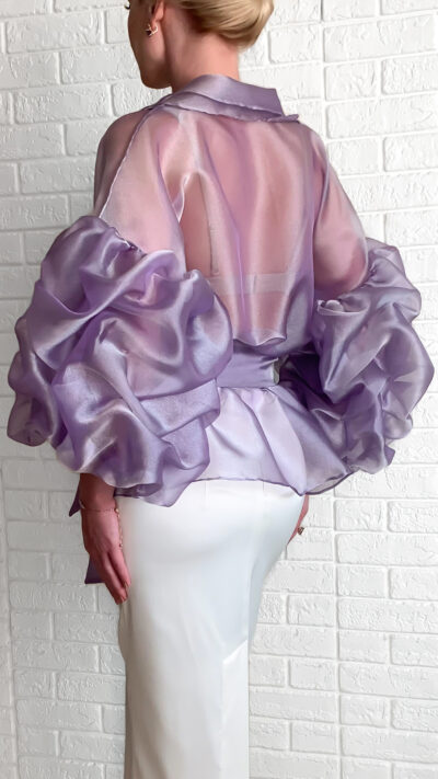 woman wearing organza blouse light purple colour with draped sleeved and a belt