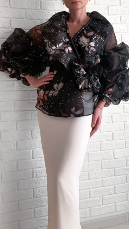 woman wearing black organza blouse with flower print