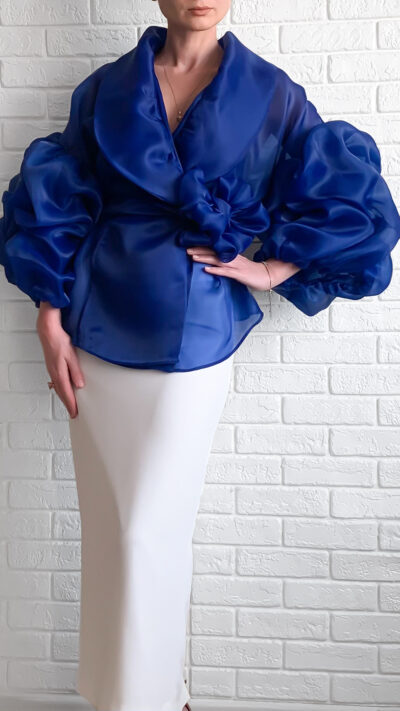 woman wearing royal blue blouse cut from organza