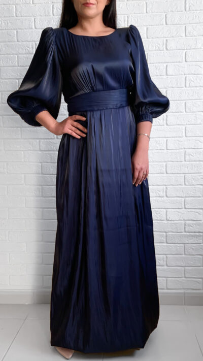 woman wearing long dress with puffy sleeves dark blue color