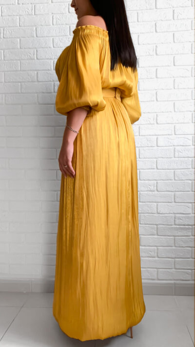 woman wearing off shoulder long dress golden colour