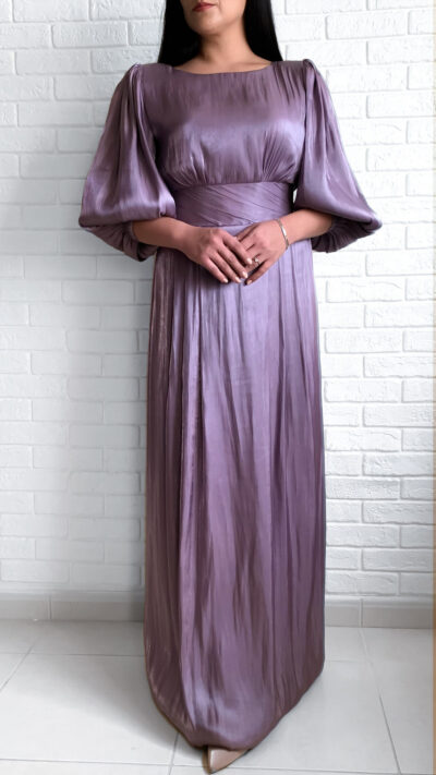 woman wearing long dress with puffy sleeves