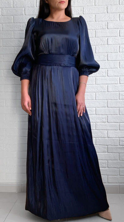 woman wearing long dress with puffy sleeves dark blue color