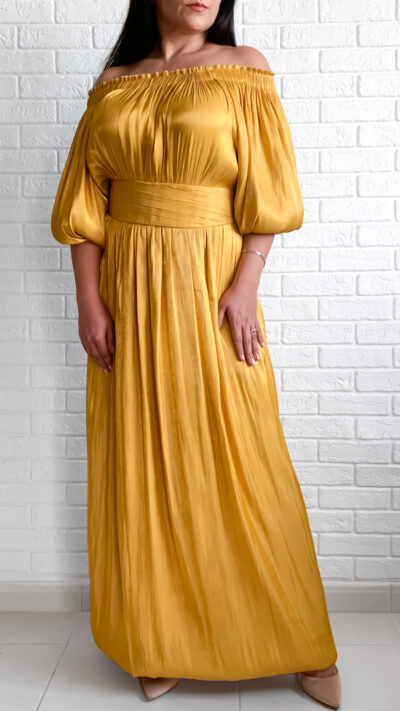 woman wearing off shoulder dress golden colour