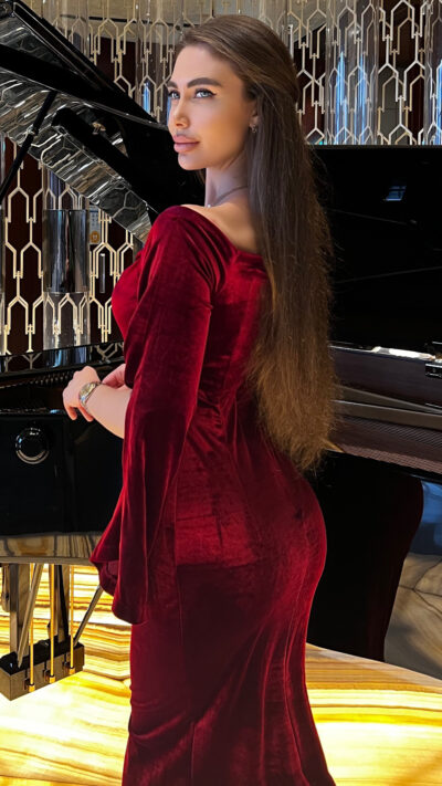 woman wearing maroon velvet dress